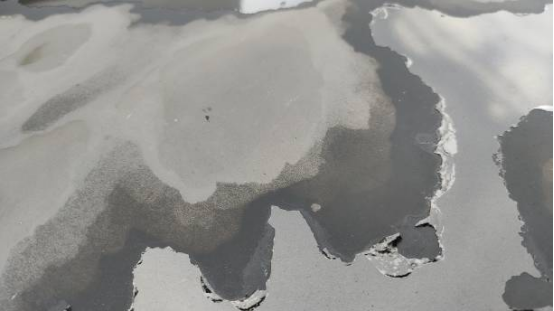 Garage floor covered in snow and salt showing coating protection.