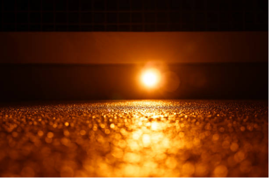 Garage Floor Coating Light Enhancement 1 Bright garage with high-gloss reflective floor coating.