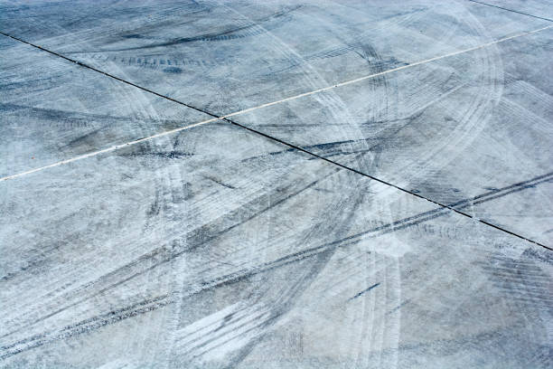 Close-up of garage floor showing tire mark-resistant coating.