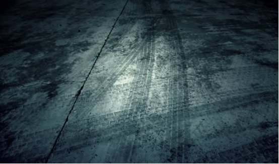 Close-up of garage floor showing tire mark-resistant coating.