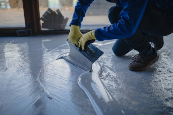 Garage floor coating's UV protection extends the lifespan of the floor. 2 Garage floor coating with UV protection reflecting sunlight.