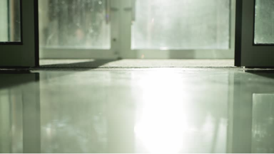 Garage floor coating's UV protection extends the lifespan of the floor. 3 Close-up of a garage floor with visible UV coating shine.