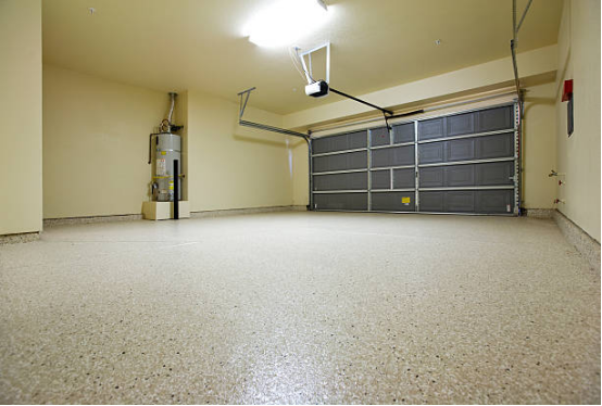 The impact of Garage Floor Coating on Garage Functional Zoning 2 Garage floor coating for storage area with organized boxes and tools