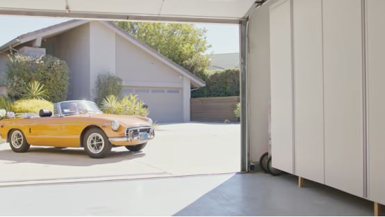 Modern garage style created by garage floor coating and unified flooring color