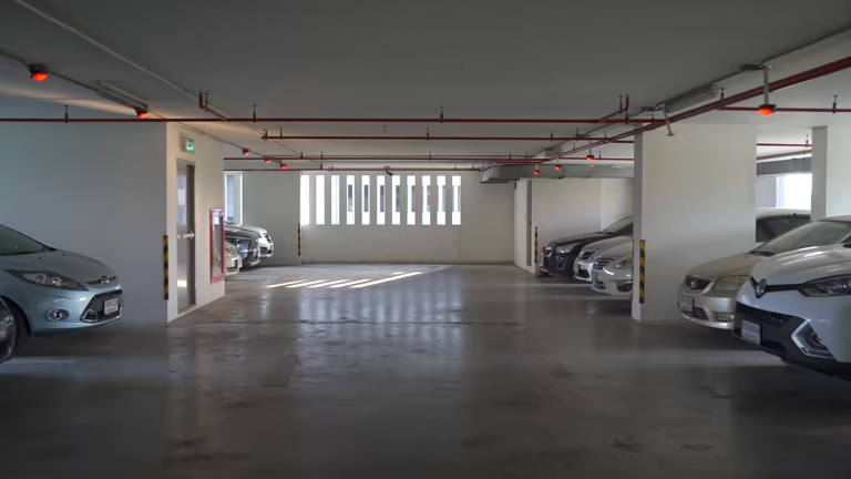 Underground parking garage with cars. Consider a durable garage floor coating for this space.