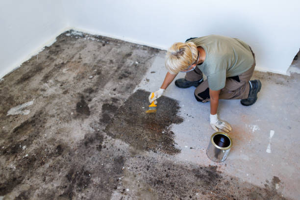 Preparing concrete for garage floor coating application.
