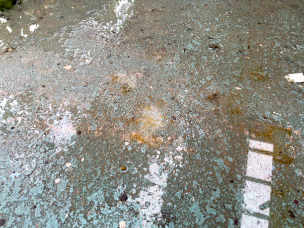 Close-up of stained concrete before garage floor coating.