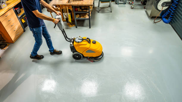 Machine cleaning for flawless garage floor coating installation.