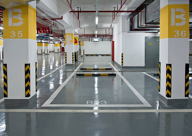 Modern multi-level parking garage features a durable grey garage floor coating.