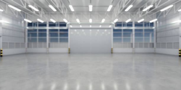 Spacious, empty industrial garage with clean concrete, perfect for new floor coating.
