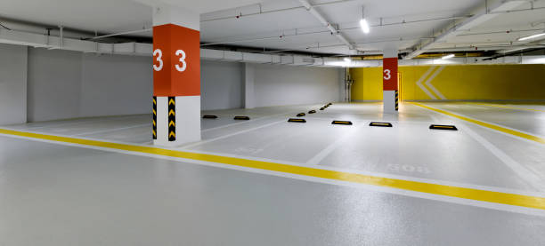 Underground parking garage with clean, durable garage floor coating and clear safety lines.