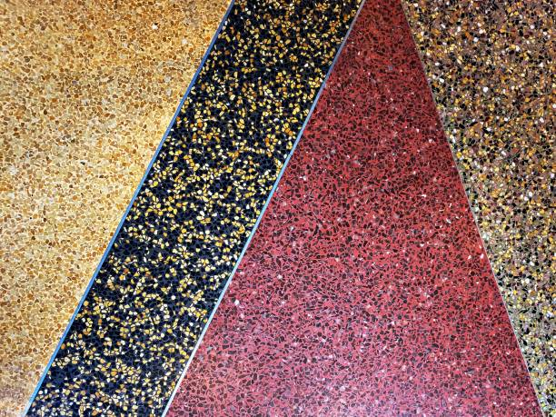 Decorative, multi-colored speckled garage floor coating with red, black, and yellow sections.
